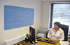 blue painted Artsorption sound absorbing panel on wall of office