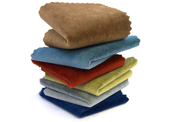 pile of folded acoustic fabric in various colours