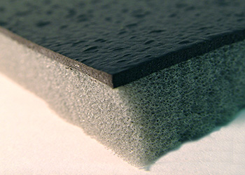 corner view of SAPT220 sound barrier mat with black face on grey foam