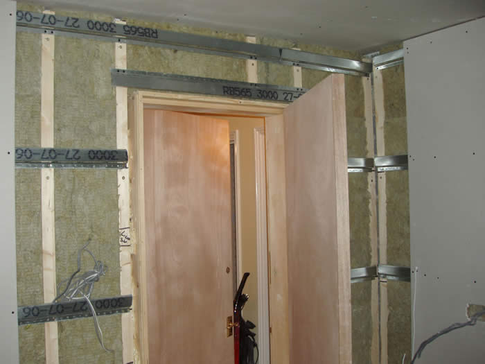 Soundproofing a wall with AMW sound absorbing acoustic mineral wool sound proofing