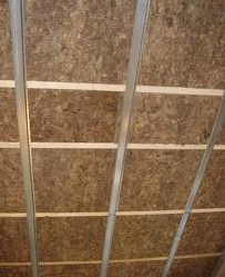 resilient bars screwed to the underside of ceiling joists