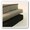 layers of sound absorbing foam and sound barrier mat
