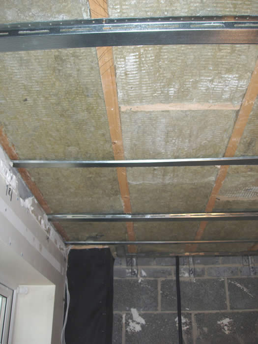 Resilient Bars fixed across the ceiling joists
